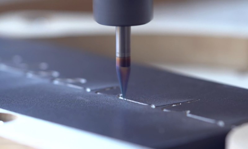 Precision tool engraving intricate patterns on a metal surface